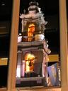The cathedral tower reflected in a modern glass tower right next door.